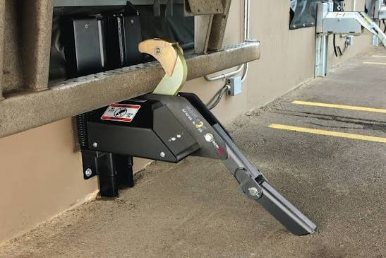 Industrial dock lock securing a trailer at loading dock
