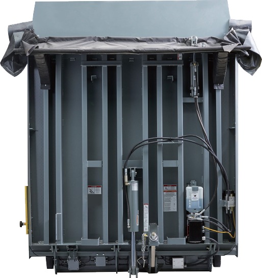 Vertical storing hydraulic dock leveler at industrial loading dock